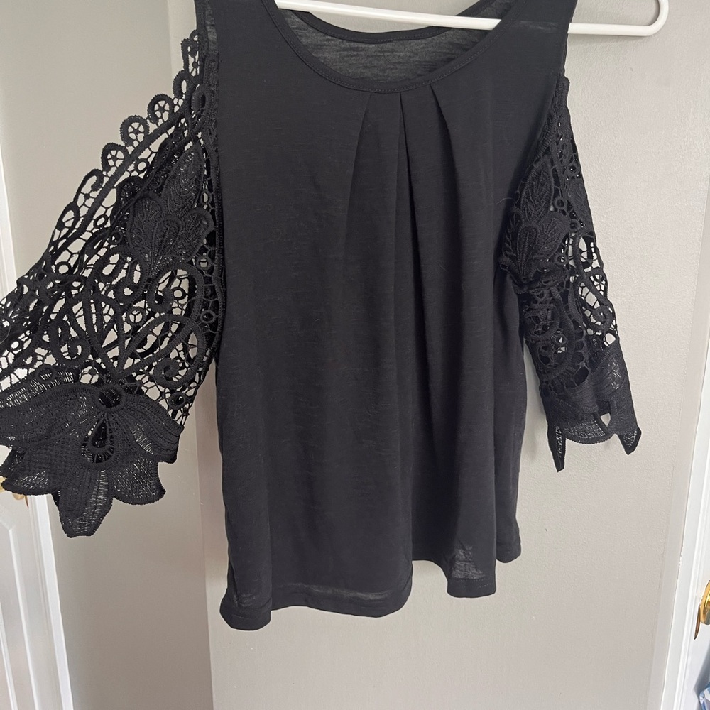 Women’s work tops. The black top has never been worn and the A.T top worn twice